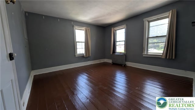 30 S Broad St, East Bangor Borough, PA 18013 - spare room with hardwood / wood-style flooring, radiator, and baseboards