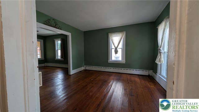 30 S Broad St, East Bangor Borough, PA 18013 - unfurnished room featuring a baseboard heating unit, hardwood / wood-style flooring, and plenty of natural light
