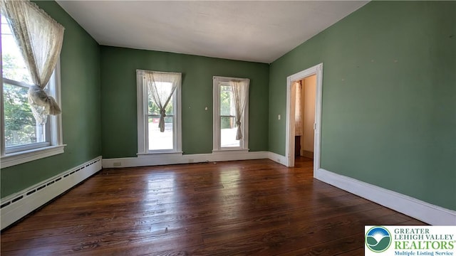30 S Broad St, East Bangor Borough, PA 18013 - unfurnished room featuring a baseboard radiator, healthy amount of natural light, hardwood / wood-style flooring, and baseboards