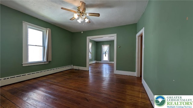 30 S Broad St, East Bangor Borough, PA 18013 - unfurnished room featuring a baseboard radiator, hardwood / wood-style flooring, baseboards, and ceiling fan
