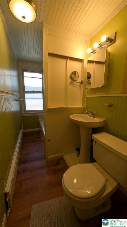 30 S Broad St, East Bangor Borough, PA 18013 - bathroom featuring toilet, wood ceiling, wood finished floors, wood walls, and wainscoting
