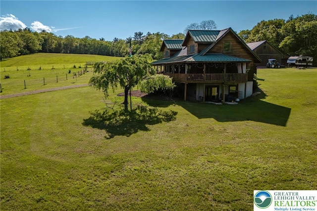 1650 Spruce Hollow Rd, Towamensing Township, PA 18071 - back of house featuring a wooden deck, a yard, a standing seam roof, and metal roof