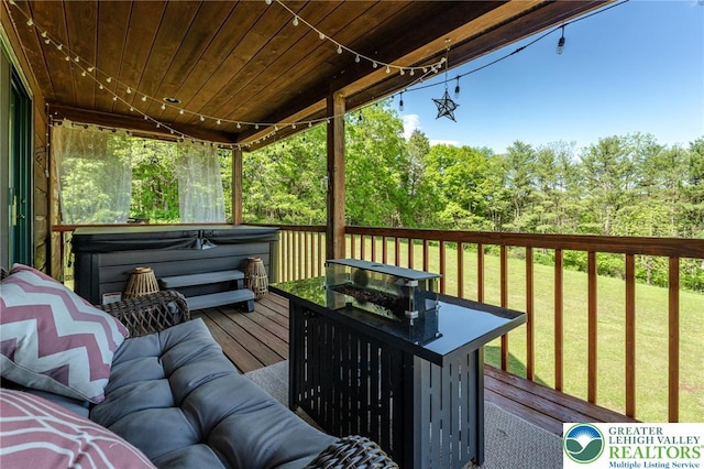 1650 Spruce Hollow Rd, Towamensing Township, PA 18071 - wooden deck with a hot tub, a lawn, outdoor lounge area, and view of wooded area