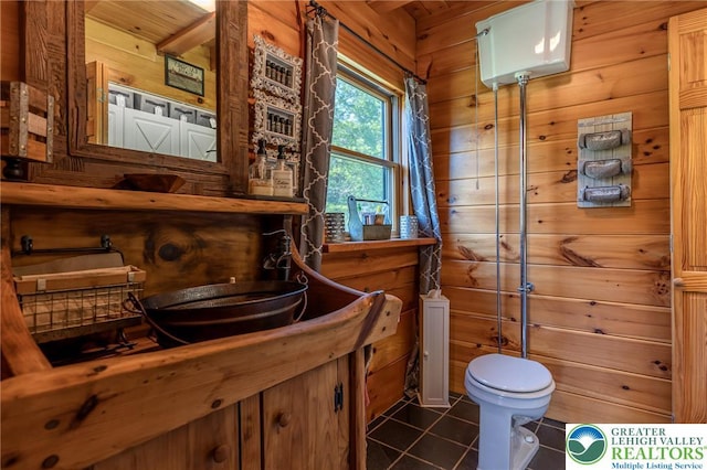 1650 Spruce Hollow Rd, Towamensing Township, PA 18071 - bathroom featuring tile patterned flooring, toilet, wooden walls, and vanity