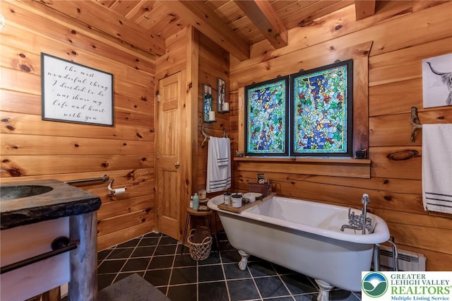 1650 Spruce Hollow Rd, Towamensing Township, PA 18071 - bathroom with tile patterned floors, baseboard heating, wooden walls, a freestanding bath, and wood ceiling with exposed beams