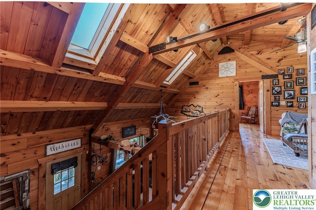 1650 Spruce Hollow Rd, Towamensing Township, PA 18071 - hallway with wooden walls, an upstairs landing, wooden ceiling, a skylight, and light wood finished floors