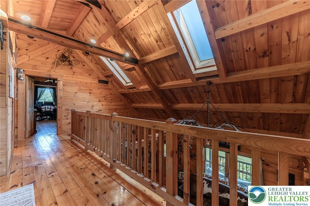 1650 Spruce Hollow Rd, Towamensing Township, PA 18071 - hall featuring a skylight, wooden walls, wood-type flooring, and wooden ceiling