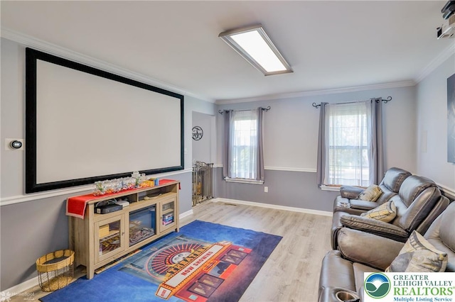 3940 Dewalt St, Bethlehem Twp, PA 18020 - home theater featuring wood finished floors, healthy amount of natural light, ornamental molding, and baseboards
