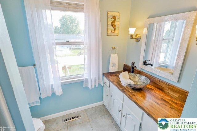 3940 Dewalt St, Bethlehem Twp, PA 18020 - bathroom with vanity, tile patterned flooring, and toilet