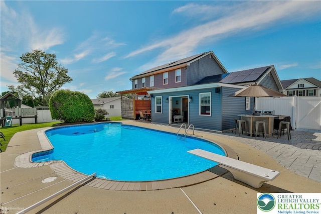 3940 Dewalt St, Bethlehem Twp, PA 18020 - view of swimming pool with a fenced backyard, a patio area, and a diving board