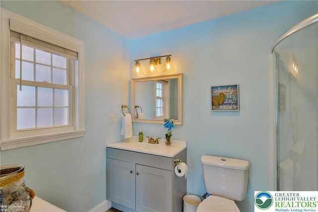 3940 Dewalt St, Bethlehem Twp, PA 18020 - bathroom featuring vanity, toilet, and an enclosed shower