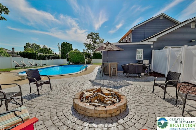 3940 Dewalt St, Bethlehem Twp, PA 18020 - view of swimming pool with a fire pit, a fenced backyard, and a patio area