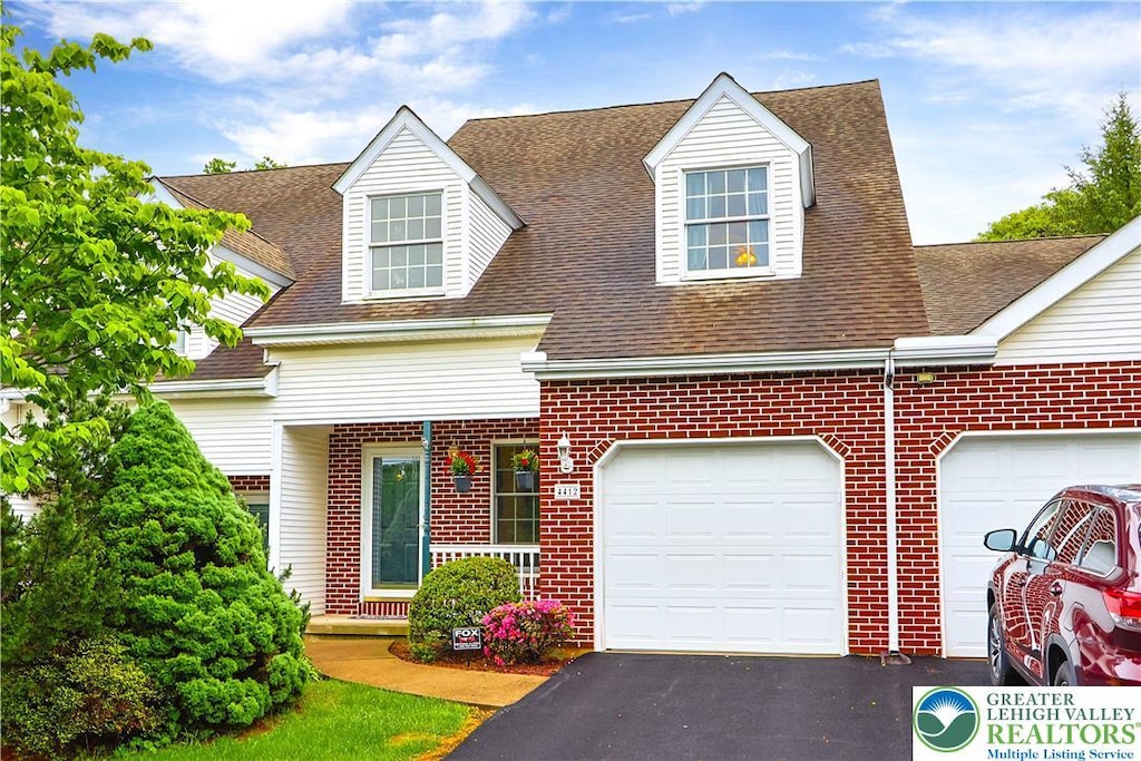 4412 W Rosebay Ct, Bethlehem Twp, PA 18020 - cape cod-style house featuring brick siding, asphalt driveway, roof with shingles, and an attached garage