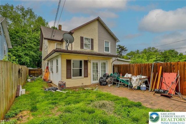4 Front St, Glendon Borough, PA 18042 - back of house featuring a chimney, french doors, and a patio area