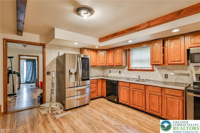 4 Front St, Glendon Borough, PA 18042 - kitchen with stainless steel appliances, light wood-style flooring, brown cabinetry, a sink, and recessed lighting