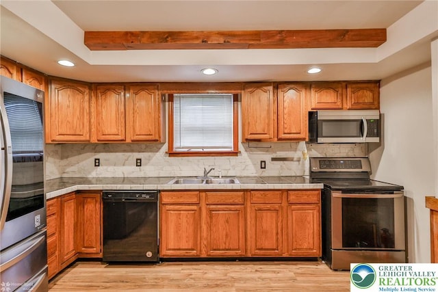 4 Front St, Glendon Borough, PA 18042 - kitchen featuring stainless steel appliances, a sink, backsplash, recessed lighting, and brown cabinets