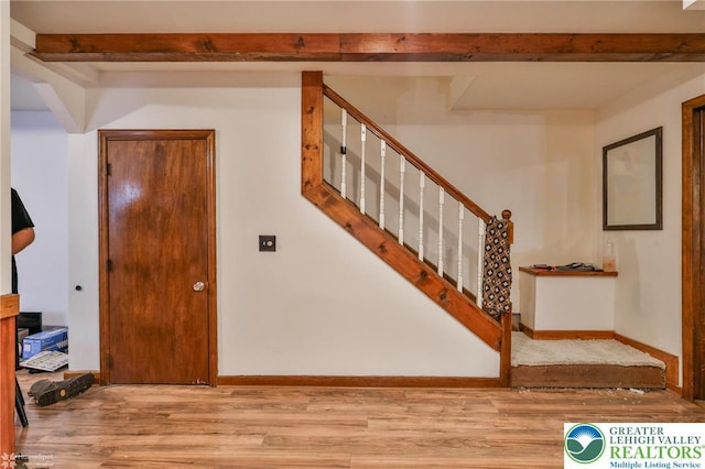 4 Front St, Glendon Borough, PA 18042 - staircase featuring wood finished floors, beam ceiling, and baseboards