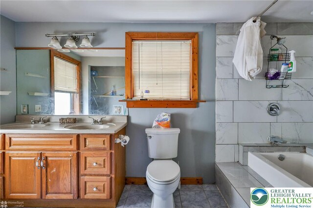 4 Front St, Glendon Borough, PA 18042 - bathroom with double vanity, tile patterned floors, toilet, and bathing tub / shower combination