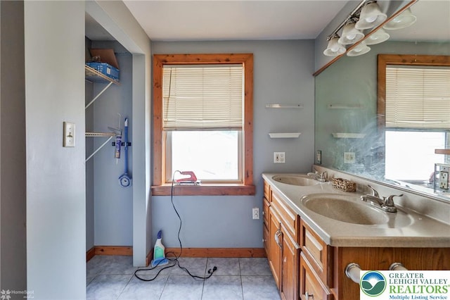 4 Front St, Glendon Borough, PA 18042 - bathroom featuring baseboards, double vanity, and tile patterned flooring