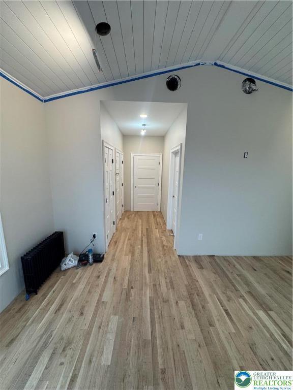 1028 Washington Blvd, Washington Twp, PA 18013 - corridor with light wood-style flooring, radiator heating unit, wood ceiling, and vaulted ceiling