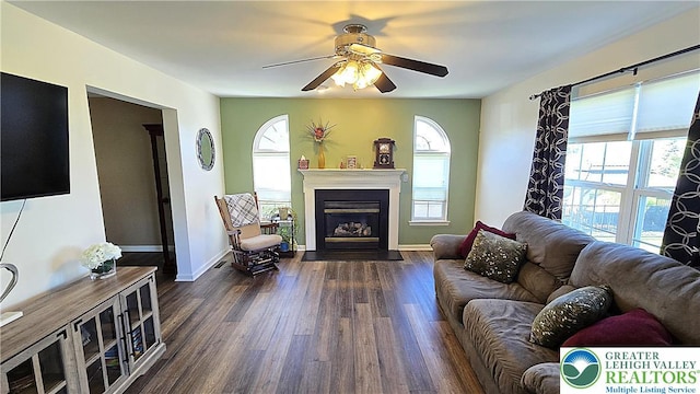 4125 Redbud Dr W, Whitehall Twp, PA 18052 - living room with a ceiling fan, dark wood-style floors, a fireplace with flush hearth, and baseboards