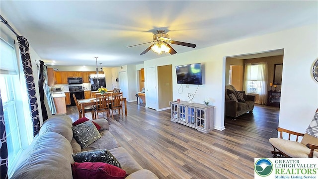 4125 Redbud Dr W, Whitehall Twp, PA 18052 - living room with ceiling fan, dark wood-style flooring, and baseboards