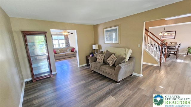 4125 Redbud Dr W, Whitehall Twp, PA 18052 - living area featuring a chandelier, dark wood finished floors, and baseboards