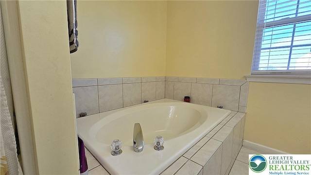 4125 Redbud Dr W, Whitehall Twp, PA 18052 - full bath featuring a bath, baseboards, and tile patterned floors