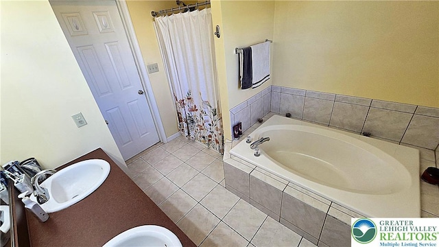 4125 Redbud Dr W, Whitehall Twp, PA 18052 - full bath featuring a garden tub, tile patterned flooring, double vanity, and a shower with shower curtain