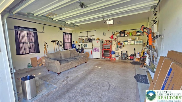4125 Redbud Dr W, Whitehall Twp, PA 18052 - garage with freestanding refrigerator and a garage door opener