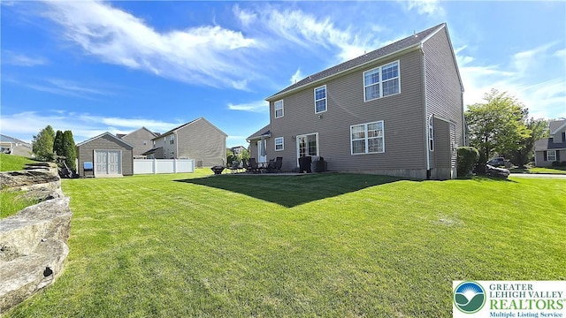 4125 Redbud Dr W, Whitehall Twp, PA 18052 - back of house featuring an outdoor structure, a residential view, and a patio area