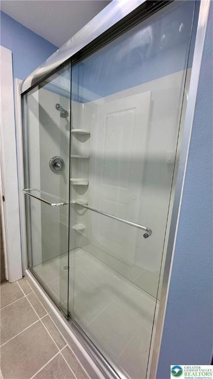 836 Elliger St, Allentown City, PA 18102 - full bath featuring a stall shower and tile patterned flooring
