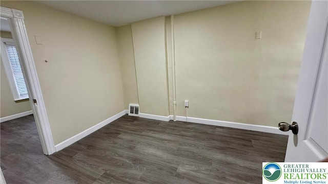 836 Elliger St, Allentown City, PA 18102 - washroom with dark wood-type flooring and baseboards