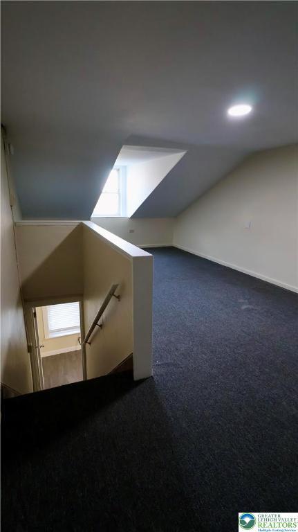 836 Elliger St, Allentown City, PA 18102 - additional living space featuring dark colored carpet and vaulted ceiling