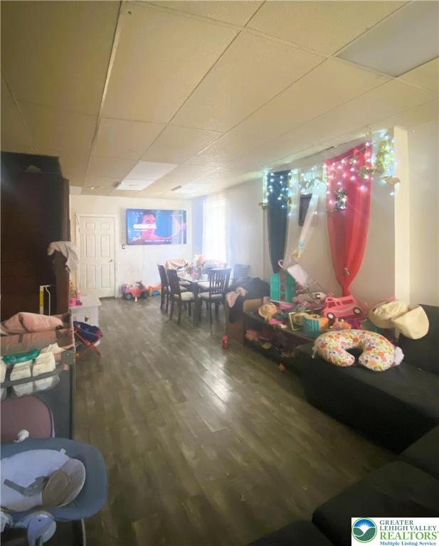 726 N 8th St, Allentown City, PA 18102 - playroom with wood finished floors and a paneled ceiling