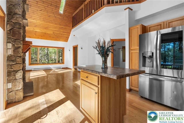 2107 Lenape Ter, Barrett Twp, PA 18325 - kitchen featuring stainless steel fridge, high vaulted ceiling, dark countertops, wooden ceiling, and wood finished floors