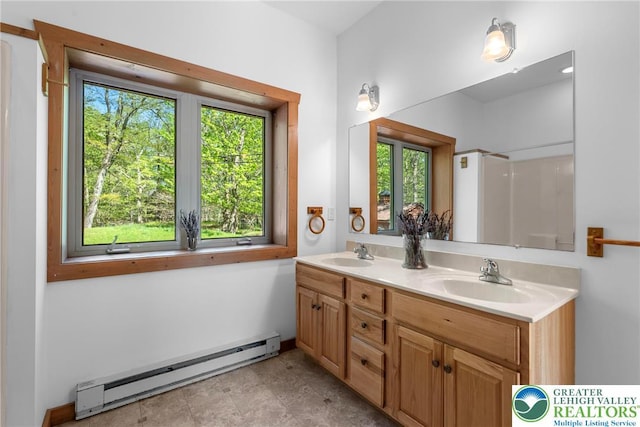 2107 Lenape Ter, Barrett Twp, PA 18325 - full bath with a baseboard heating unit, double vanity, and a shower