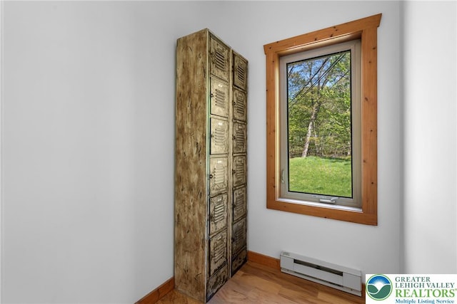 2107 Lenape Ter, Barrett Twp, PA 18325 - doorway with a baseboard heating unit, baseboards, and light wood-style floors