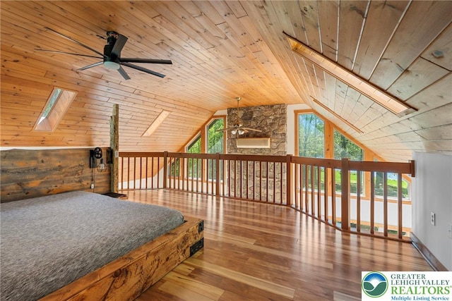 2107 Lenape Ter, Barrett Twp, PA 18325 - bedroom featuring a skylight, wood ceiling, lofted ceiling, wood-type flooring, and multiple windows