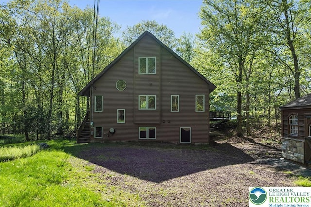 2107 Lenape Ter, Barrett Twp, PA 18325 - rear view of house featuring stairs
