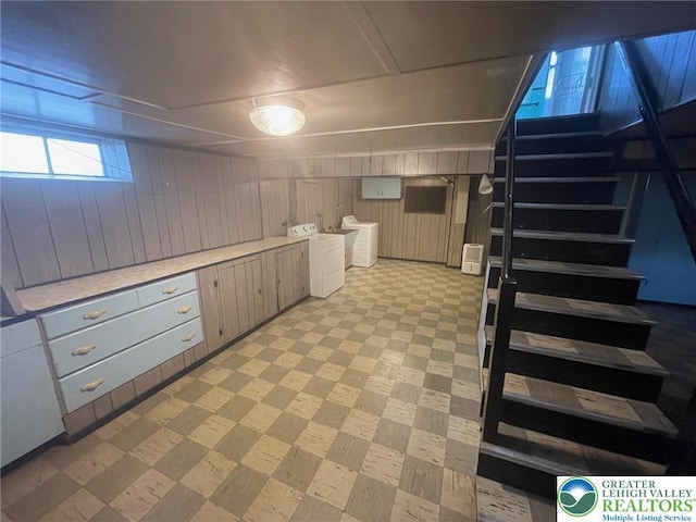 1123 Cumberland Rd, Abington, PA 19001 - basement with washer and clothes dryer, light floors, wood walls, and stairs