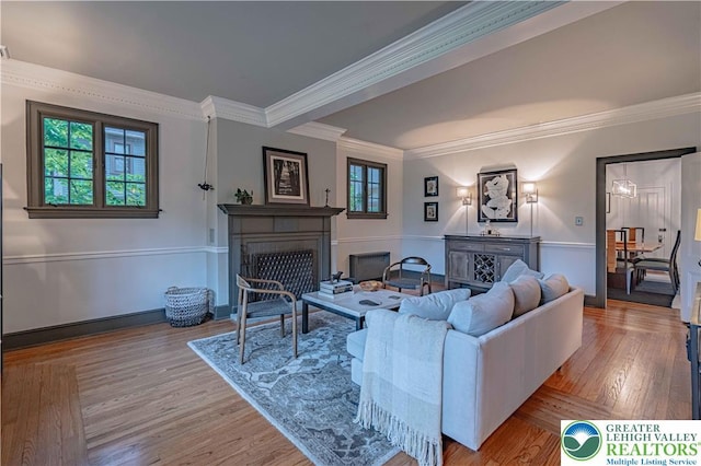 306 W Paxinosa Rd, Forks Twp, PA 18040 - living room with a fireplace, wood finished floors, crown molding, and baseboards