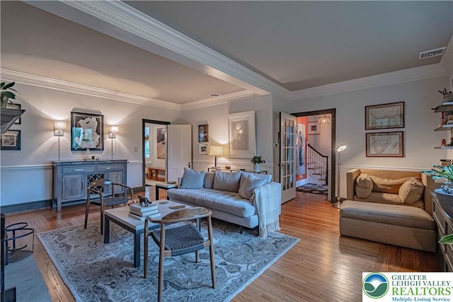 306 W Paxinosa Rd, Forks Twp, PA 18040 - living area with stairway, wood finished floors, crown molding, and baseboards
