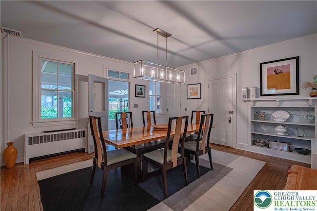 306 W Paxinosa Rd, Forks Twp, PA 18040 - dining area with radiator, wood finished floors, and ornamental molding