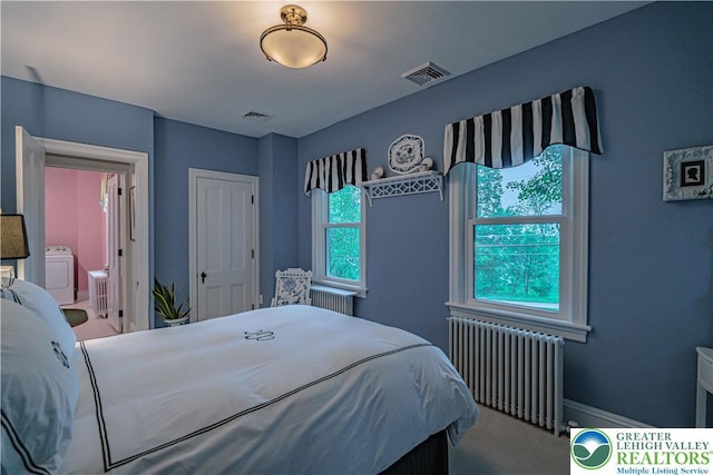 306 W Paxinosa Rd, Forks Twp, PA 18040 - carpeted bedroom with radiator and washer / clothes dryer