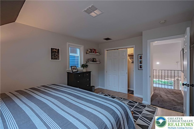 306 W Paxinosa Rd, Forks Twp, PA 18040 - bedroom with wood finished floors, a closet, and multiple windows