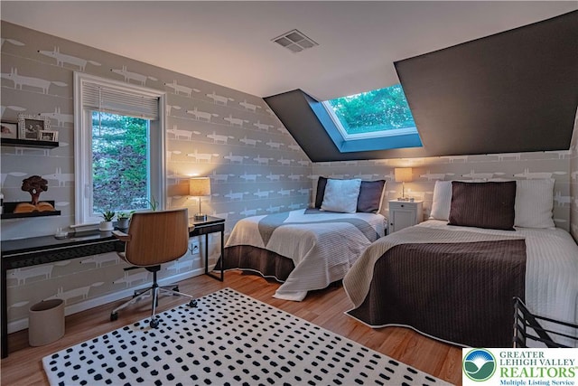 306 W Paxinosa Rd, Forks Twp, PA 18040 - bedroom with a skylight, wood finished floors, and wallpapered walls