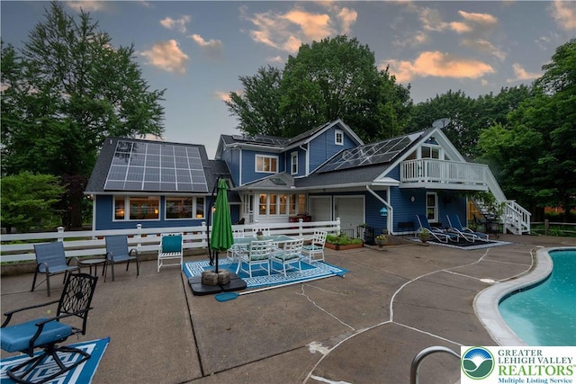 306 W Paxinosa Rd, Forks Twp, PA 18040 - back of house with solar panels, stairs, a patio, and an outdoor pool