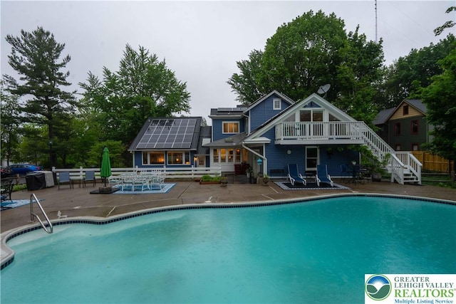 306 W Paxinosa Rd, Forks Twp, PA 18040 - view of swimming pool with a patio, stairs, and a wooden deck