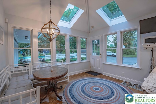 306 W Paxinosa Rd, Forks Twp, PA 18040 - sunroom with a skylight, baseboards, a chandelier, plenty of natural light, and vaulted ceiling